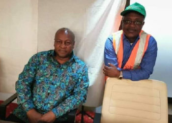 Mahama enjoys Akufo-Addo’s change as he grabs Ghana Card.