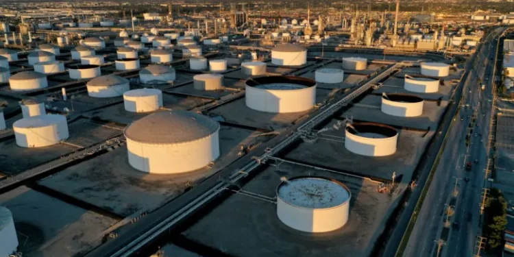 Oil firms on tight supply as US driving season looms